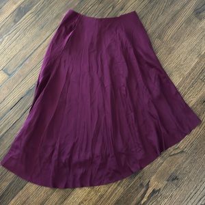 Asymmetrical plum silk skirt with pockets